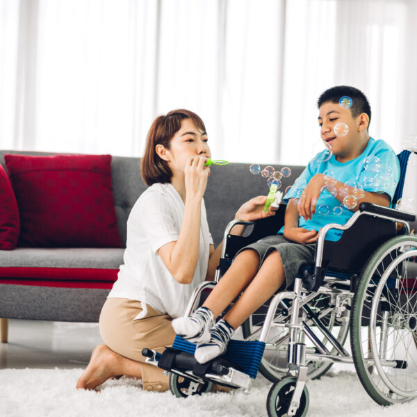 Professional Home care nurse assisting  a young child at homet at home