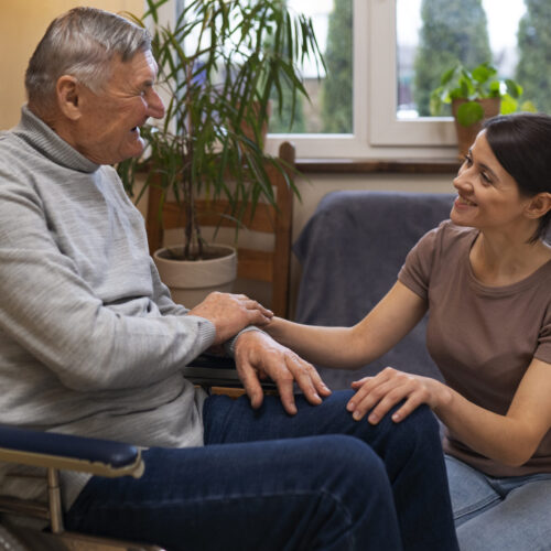 elderly-person-being-taken-care-by-female-caretaker